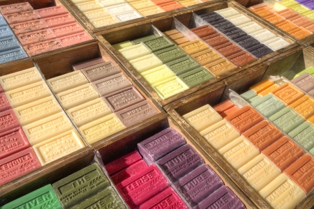French soap bars with many colourful perfumes on market in Apt, Provence in diagonal shot in wooden cratesのeditorial素材