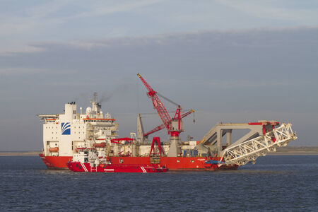 Pipelay vessel, dedicated to lay oil and gas pipes in shallow and deep waters, seeking refuge for...