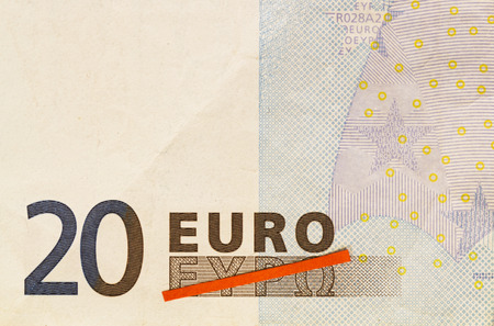 Grexit, Greece exiting the Euro visualized by red line crossing out Greek word for Euro on 20 Euro...