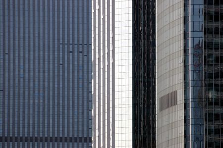 China, modern Chinese skyscrapers close photos - visable windows, glass panels, reflections, walls.の写真素材