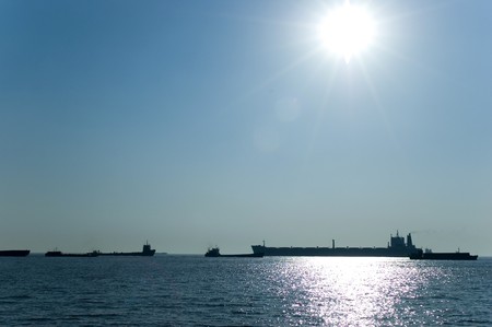 Ships passing Yangtze river, canal near Nantong city, Jiangsu province, vessels heading to East China Sea.の写真素材