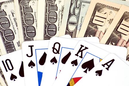 Gambling - American dollars and poker cards. Photo of different banknotes, money in different shapes...