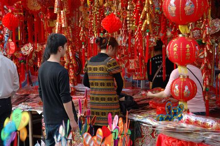CHINA, SHENZHEN - FEBRUARY 10: Chinese people searching colorful decorations for Chinese New Year on February 10, 2010 in Shenzhen, China.のeditorial素材