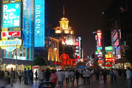 CHINA, SHANGHAI, NANJING ROAD - MAY 12, 2007: shopping paradise in China, famous Nanjing Lu with thousands of shops, neon lights, crowd of people.のeditorial素材