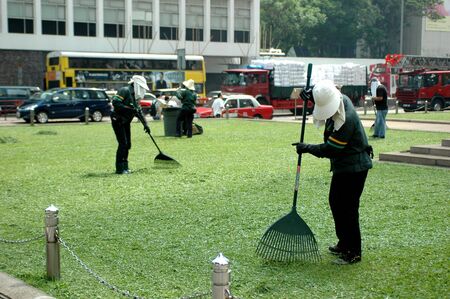 HONG KONG, CENTRAL - MAY 17, 2007: cleaners working in city center. 