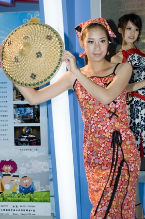 CHINA, GUANGDONG, SHENZHEN - MAY 18, 2009: China Cultural Industries Fair: beautiful Chinese girls from Shanxi province, promoting their region. のeditorial素材