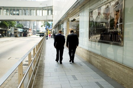 HONG KONG - OCTOBER 30: Two businessman walking in city center, going back from lunch on October 30, 2008 in Hong Kong.のeditorial素材