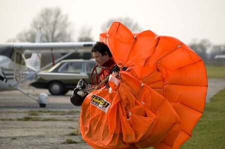WROCLAW, POLAND - APRIL 3: Undefined parachute jumper starts new season on April 3, 2011. Jumper returns from airfield.のeditorial素材