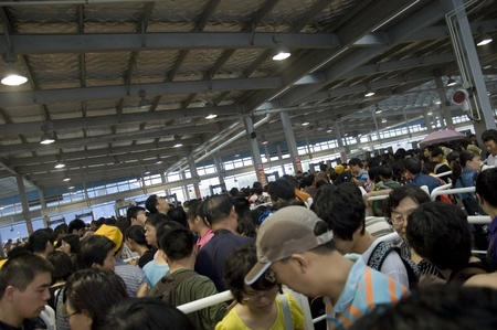 CHINA, SHANGHAI - JUNE 28: Shanghai Expo 2010, Chinese people waiting in long queue to enter Expo on...