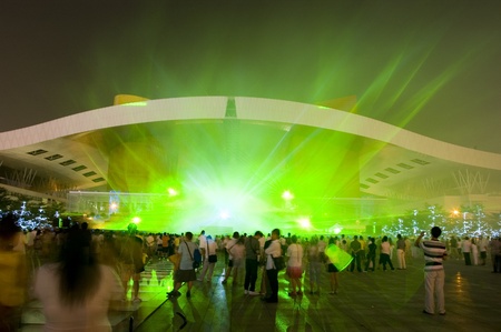 CHINA, SHENZHEN - OCTOBER 5: Shenzhen Civic Center, crowd watches night laser show. Celebration of 60th Anniversary of the People's Republic of China on October 5, 2009.のeditorial素材