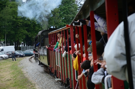 KROSNICE, DOLNY SLASK, POLAND - MAY 25: Restored narrow gauge railroad in Krosnice. Unidentified group of people inside the train on 25 May 2013 in Krosnice, Poland.のeditorial素材