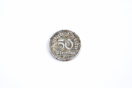 Old German pfenning from 1921. Old rusty coin dug out of the ground.