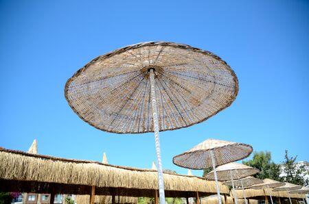 Holiday resort, straw umbrella with blue sky. Vacation in Bodrum, Turkey.の写真素材