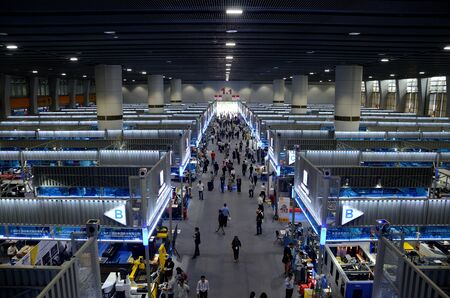 GUANGZHOU (CANTON), CHINA - 19 OCTOBER: 126th Canton Fair, China Import and Export Fair. Visitors from all around the World inside machinery hall on October 19th, 2019.のeditorial素材