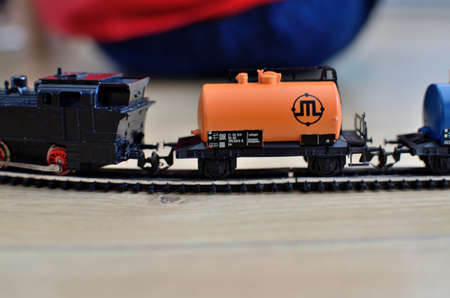 Miniature toy train, orange tank with metal rails, scale 1: 120. Vintage toy from 80's.