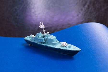 Glued and hand painted toy made of plastic. Small vessel - corvette wirh rockets, Russian ship.