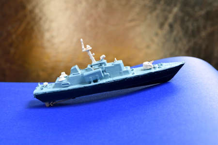 Glued and hand painted toy made of plastic. Small vessel - corvette wirh rockets, Russian ship.の写真素材
