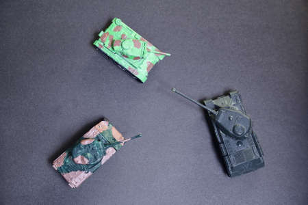 Glued toys - plastic tanks from 2nd World War. Russian and American tank and German flame thrower.の写真素材