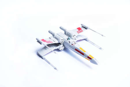 Plastic glued toys X-Wing from Star Wars. Small plane with colorful stickers.のeditorial素材