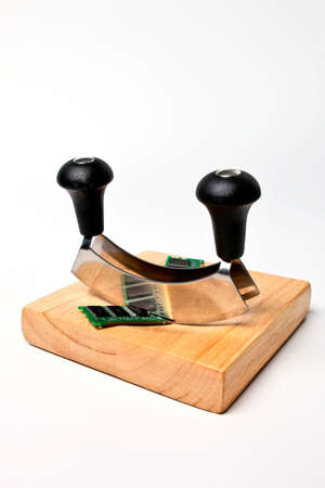 RAM chip cut in half by metal edge.の写真素材