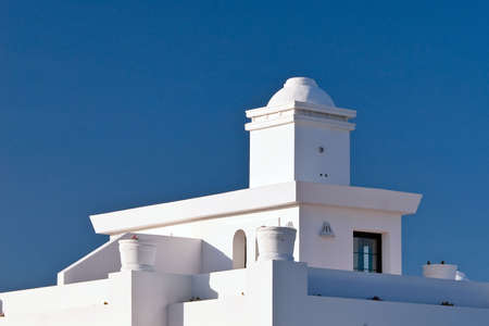 Penthouse with balcony over a blue sky view.の写真素材