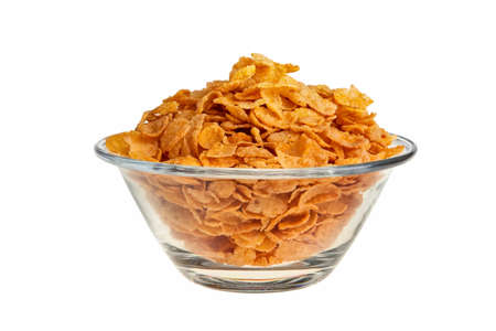 Cornflakes in glass bowl isolated over white background.の写真素材