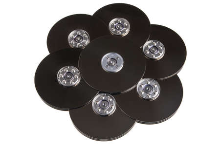 Computer hard drive disc plates in pattern, isolated over white background.