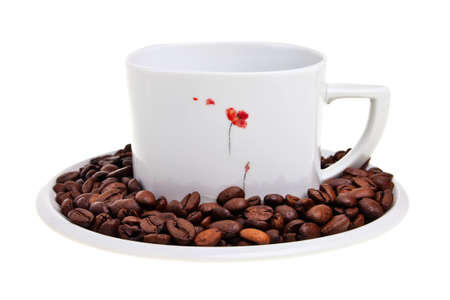 White cup with coffee beans on saucer isolated over white background. の写真素材