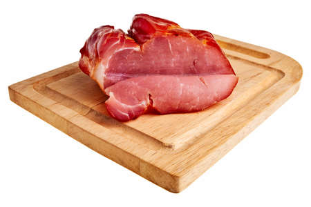 Smoked bacon on wooden board isolated over white background.の写真素材