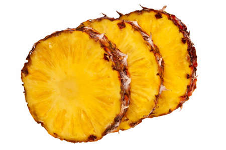 Three pineapple slices isolated over white background.の写真素材