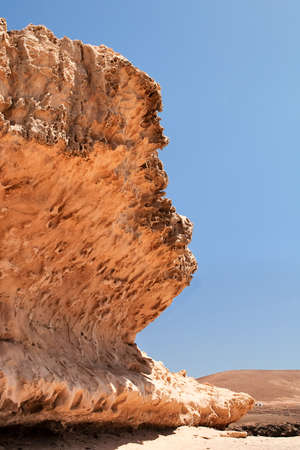 Volcanic rock formation over blue sky background.の写真素材