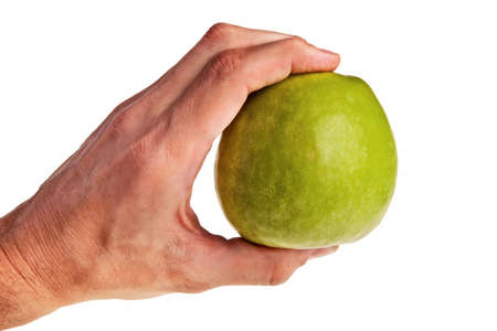 Green apple hold in male caucasian hand isolated over white background.の写真素材
