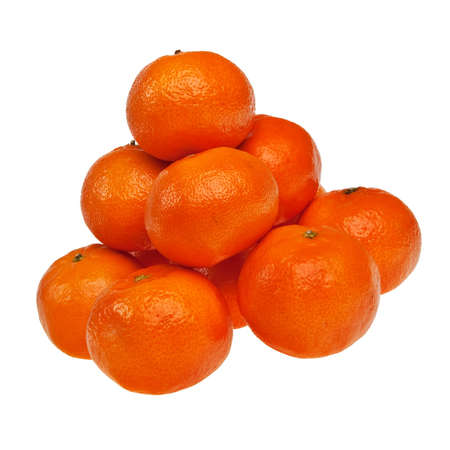 Piled ripe mandarins isolated over white background.の写真素材