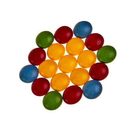 Button shaped colorful candies over white background in hexagon pattern.の写真素材
