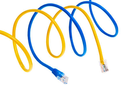Yellow and blue patch cords with plugs isolated over white background.