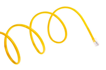 Yellow patch cord with RJ45 plugs isolated over white background.の写真素材
