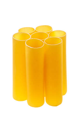 Italian cannelloni pasta tubes stacked over white background.の写真素材