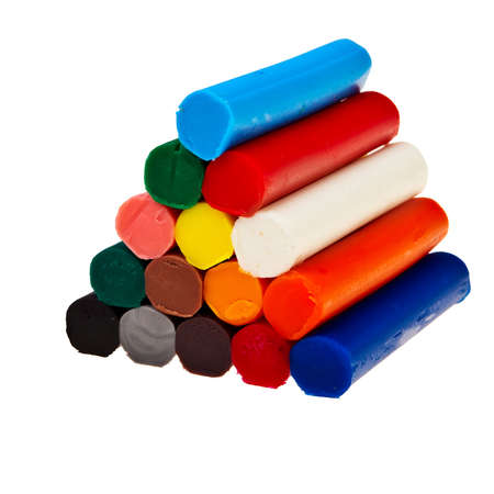 Colorful soft plasticine bars in pyramid isolated over white background.の写真素材