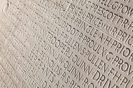 Names of soldiers engraved in white marble tombstone at Vimy War Canadian memorial.の写真素材