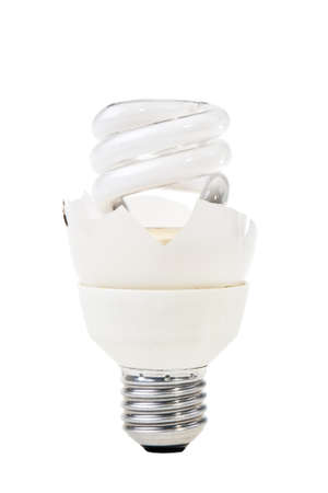 Damaged modern elecricity saving lightbulb isolated over white background.の写真素材