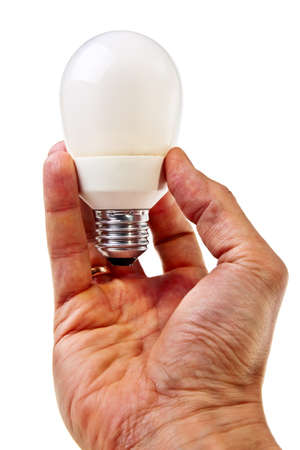 Modern electricity saving lightbulb hold by male hand over white background.の写真素材