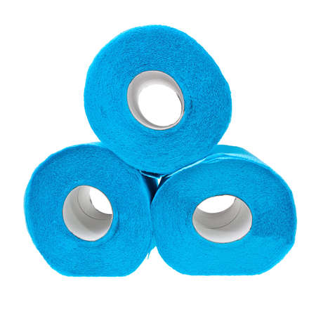 Three stacked rolls of soft blue toilet paper isolated over white background.の写真素材