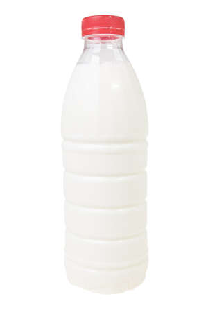 Milk in plastic bottle with red cap isolated over white background.の写真素材