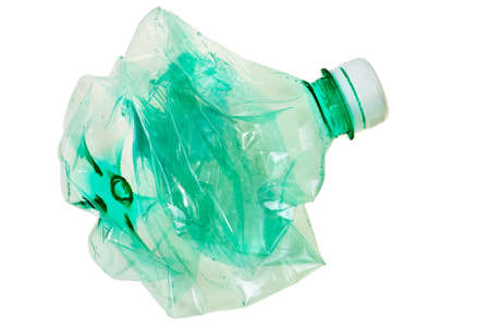 Squeezed green PET bottle ready for recycling isolated over white background.
