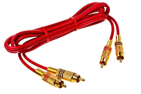Red cinch audio cable with golden plugs isolated over white background.の写真素材