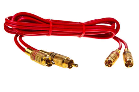 Red cinch audio cable with golden plugs isolated over white background.の写真素材