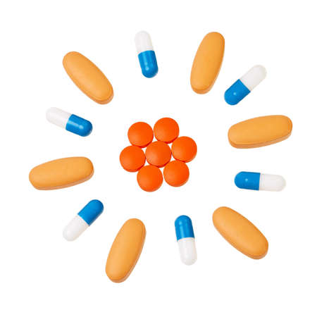 Colorful pills in circular pattern isolated over white background.の写真素材