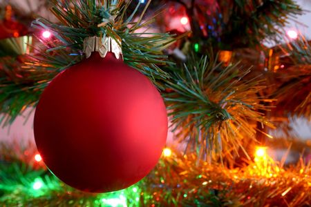 red glass ball on Christmas treeの写真素材