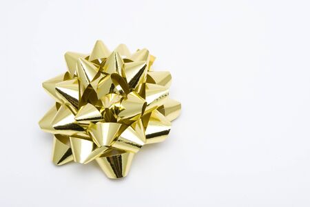gold Christmas gift ribbon on white backgroundの写真素材