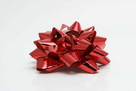 red Christmas gift ribbon on white background